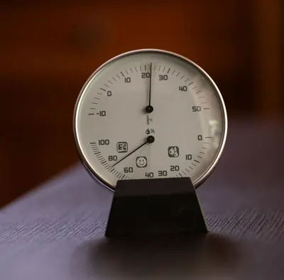 Analog hygrometer dial showing room humidity