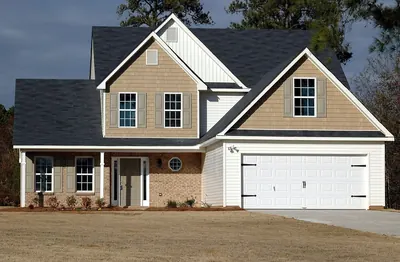 Two-story house with a two-car garage and brick front